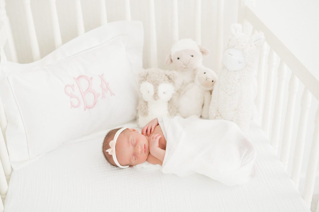 Newborn baby in a crib